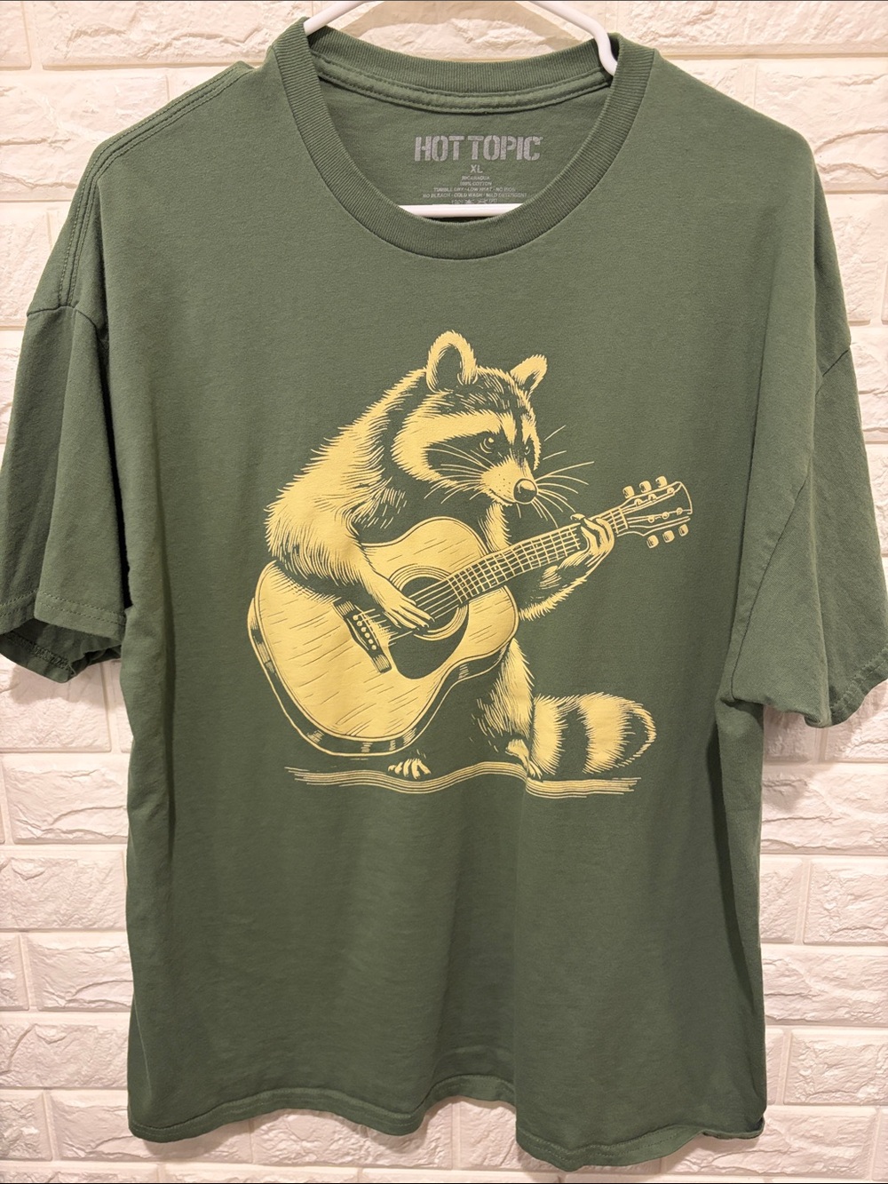 Hot Topic Olive Green Tee with Yellow Raccoon Guitar Graphic